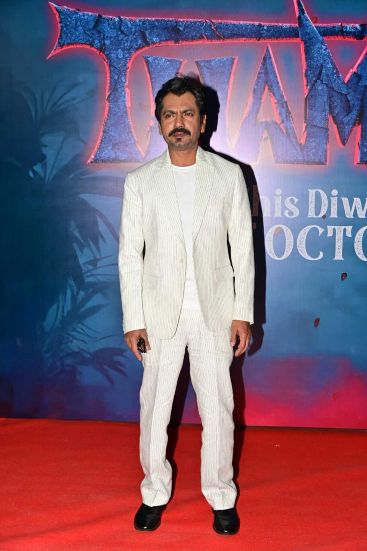 Nawazuddin Siddiqui, who is all set to essay antagonist in the show too arrived in white suit set at the premiere night.